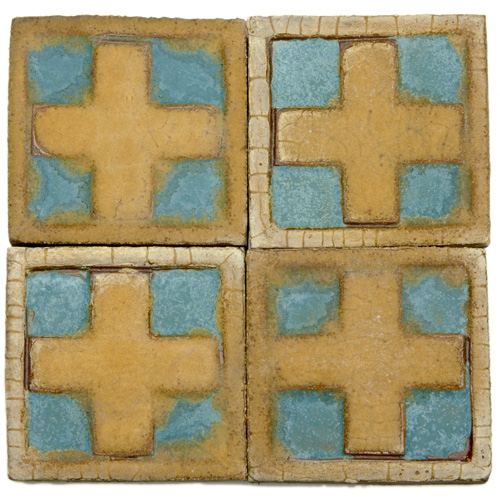 Appraisal: GRUEBY Forty-six tiles with a raised cross and border pattern