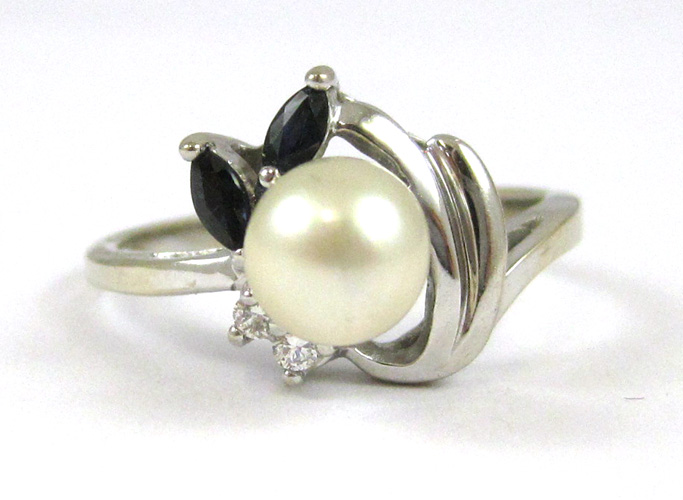 Appraisal: SAPPHIRE PEARL AND DIAMOND RING The k white gold ring