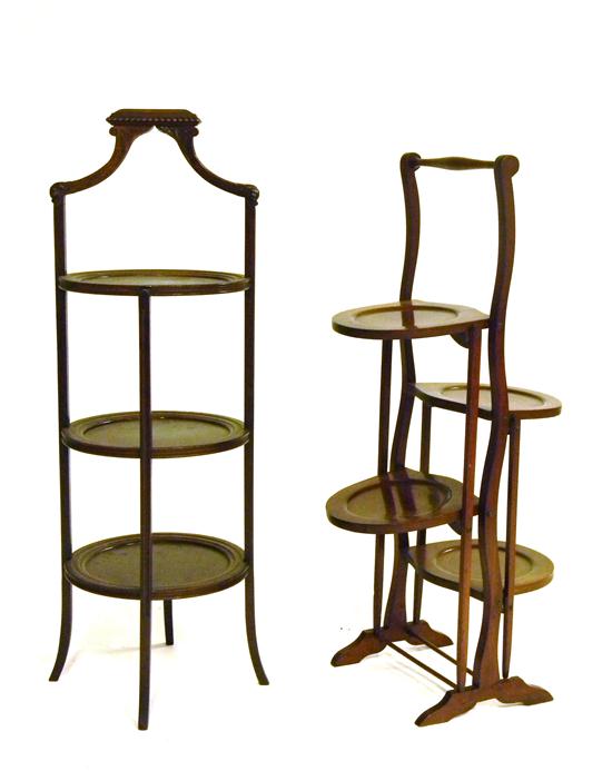 Appraisal: Two muffineers tallest with carved handle and three circular shelves