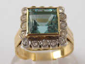 Appraisal: A yellow metal tests carat gold aquamarine and diamond ring