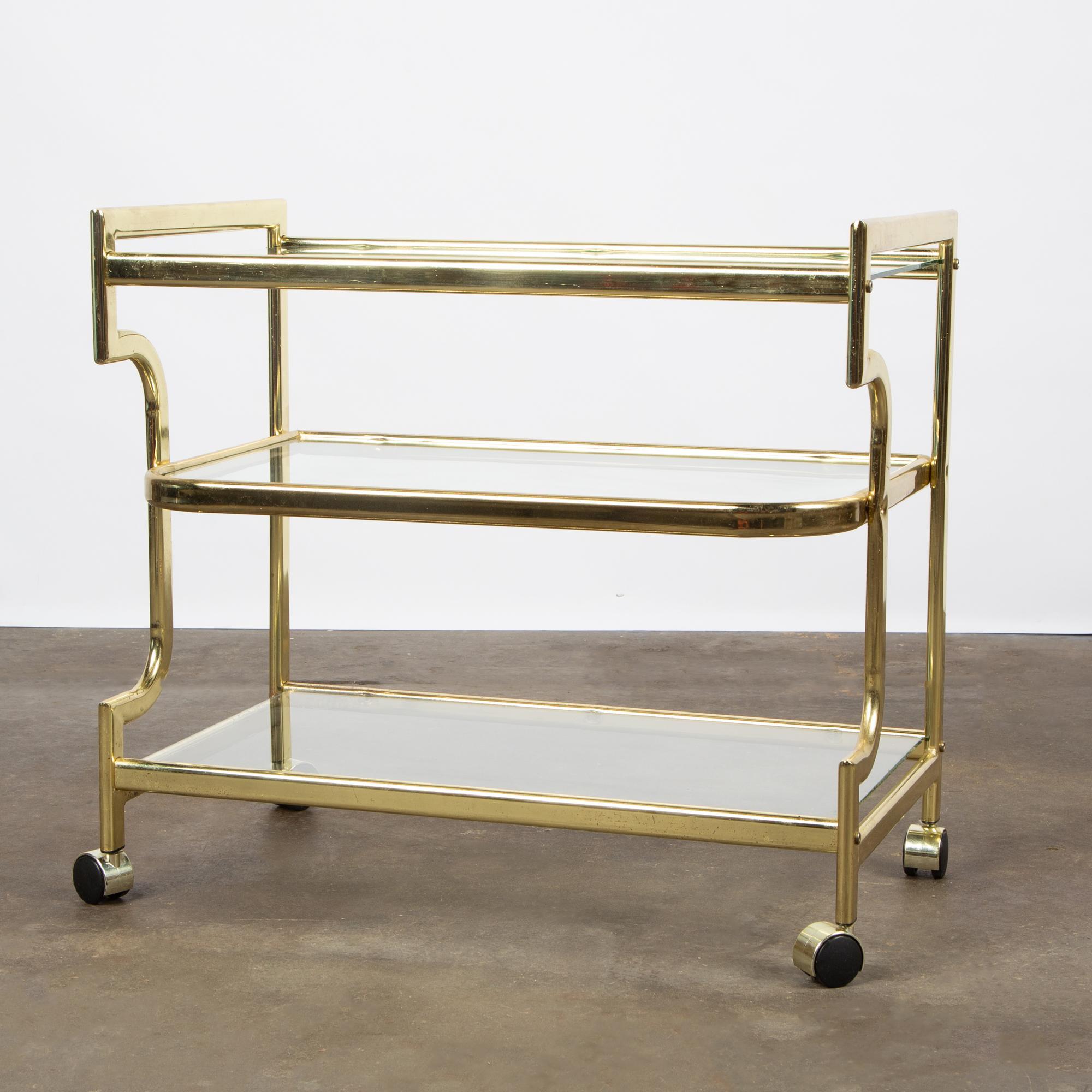 Appraisal: BRASS AND GLASS TEA CART A vintage tea cart made