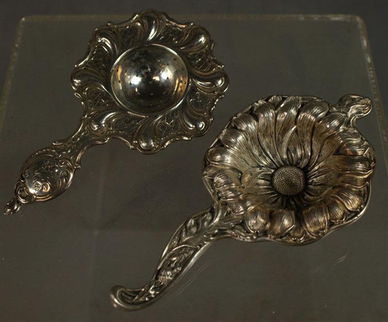 Appraisal: Sterling repousse and Continental silver tea strainers l TO Estimate