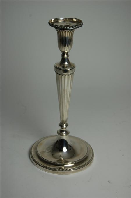 Appraisal: A George III table candlestick probably John Schofield London fluted