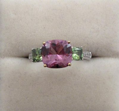 Appraisal: An unusual deep pink spinel and demantoid garnet ring The