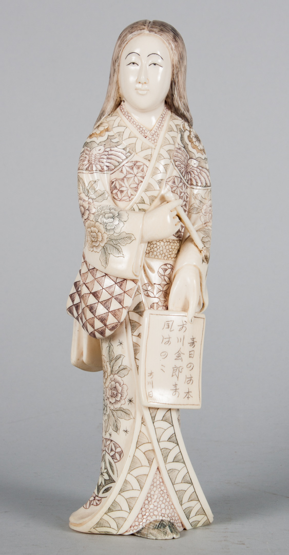 Appraisal: Japanese carved ivory poet modeled as woman holding tablet and