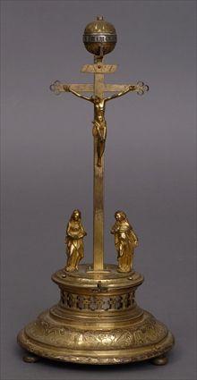 Appraisal: CONTINENTAL RENAISSANCE GILT-METAL CRUCIFIXION GROUP WITH CLOCK The cross with