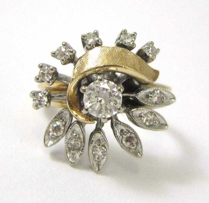 Appraisal: DIAMOND AND FOURTEEN KARAT GOLD RING The white and yellow