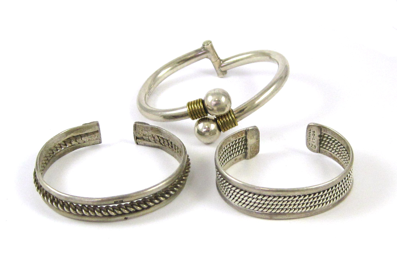 Appraisal: THREE STERLING SILVER BRACELETS including two cuff bracelets and one