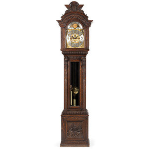 Appraisal: A Renaissance Revival Carved Oak Tall Case Clock retailed by