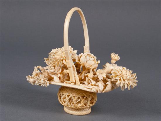 Appraisal: Chinese carved ivory floral bouquet in basket late th century