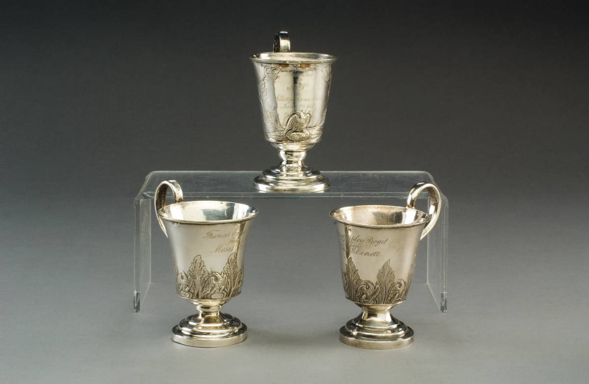 Appraisal: PAIR OF AMERICAN SILVERPLATE CHILDREN'S CUPS AND A SINGLE EXAMPLE