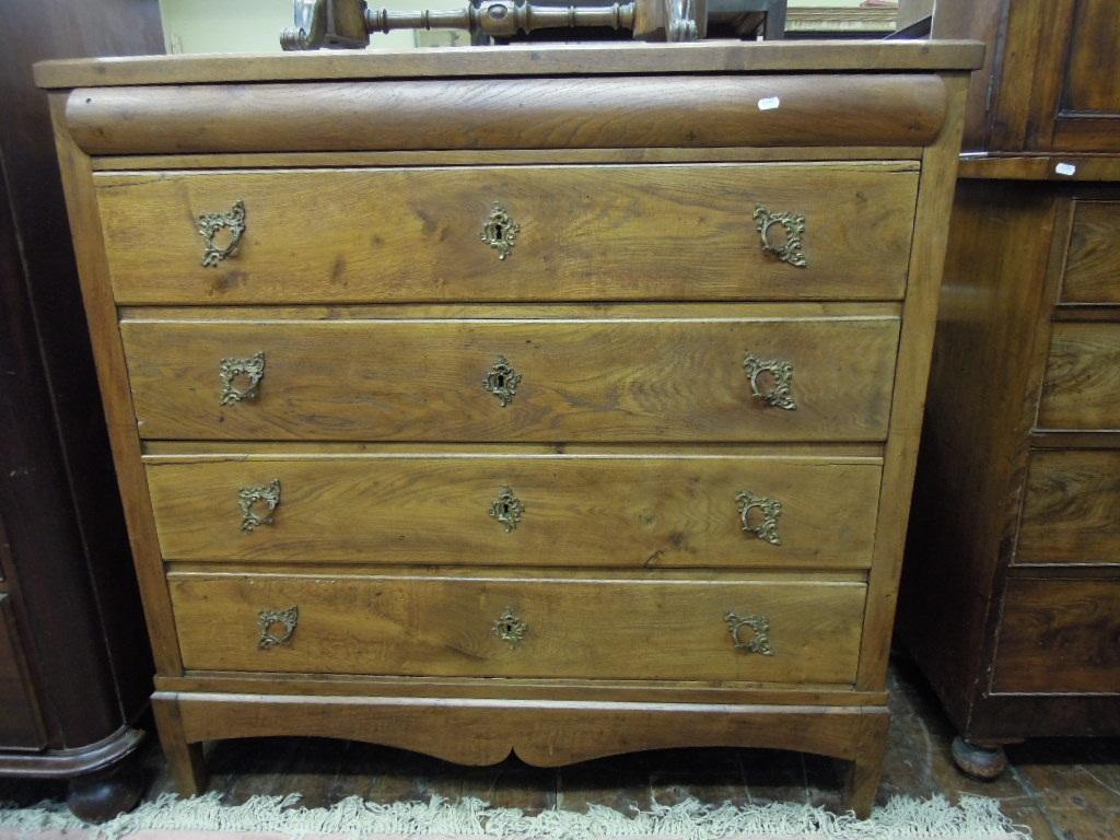 Appraisal: A plain oak chest fitted with an arrangement of five