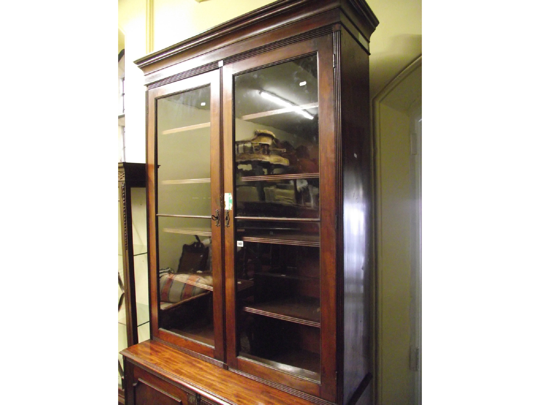 Appraisal: A Regency mahogany library bookcase the lower section enclosed by