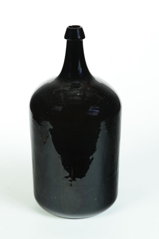 Appraisal: LARGE GLASS BOTTLE American th century Dark olive amber with