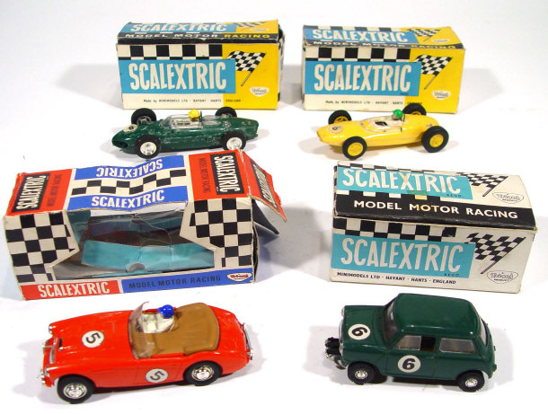 Appraisal: Four boxed Scalextric Triang motor racing vehicles Lotus Ferrari Austin