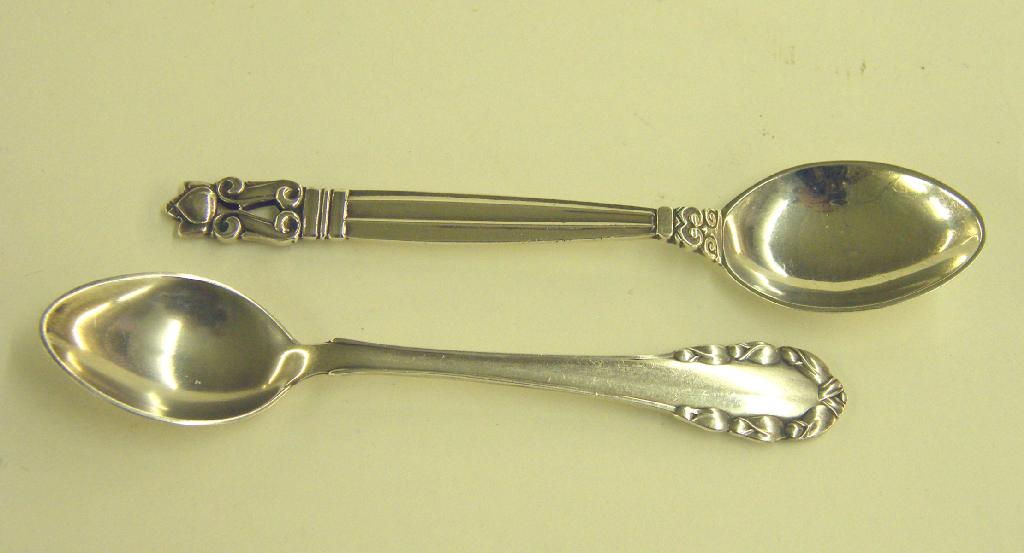 Appraisal: Two Georg Jensen silver teaspoons stamped marks