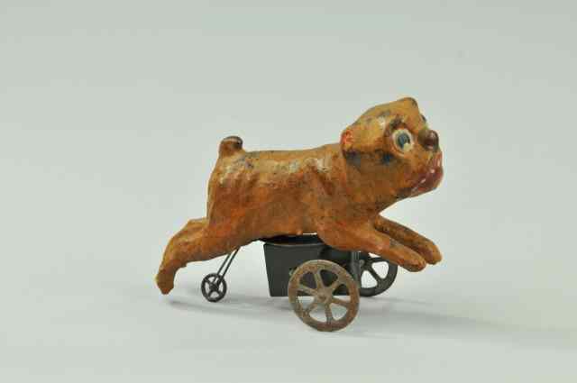 Appraisal: MECHANICAL DOG TOY Unusual hand painted dog on wheeled base