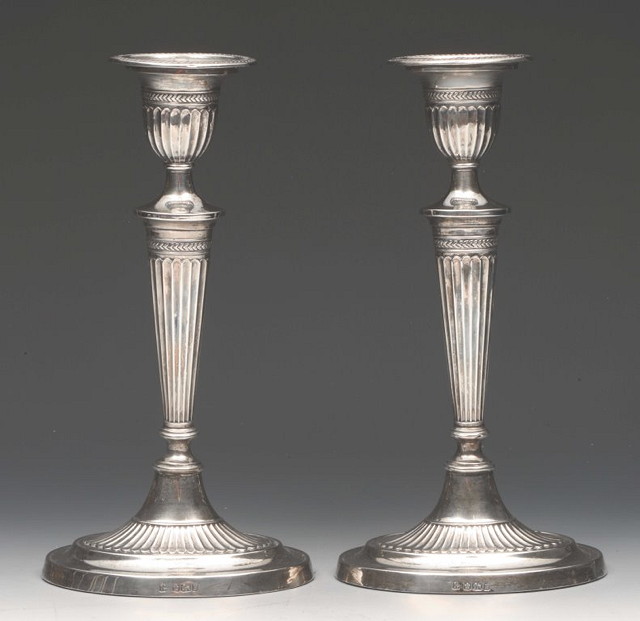 Appraisal: A PAIR OF SILVER CANDLESTICKS in the classical style of