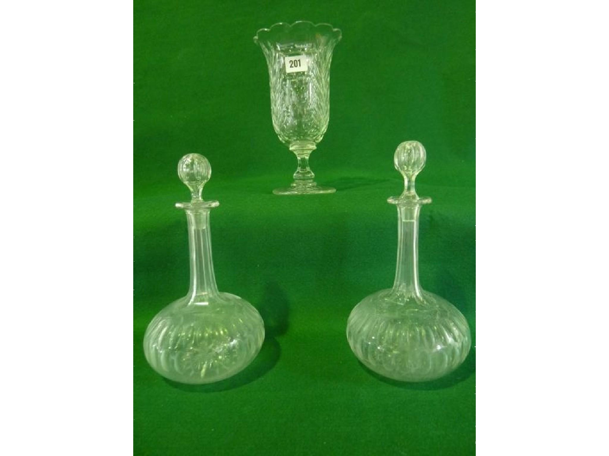 Appraisal: A pair of th century shaft and globe decanters decorated