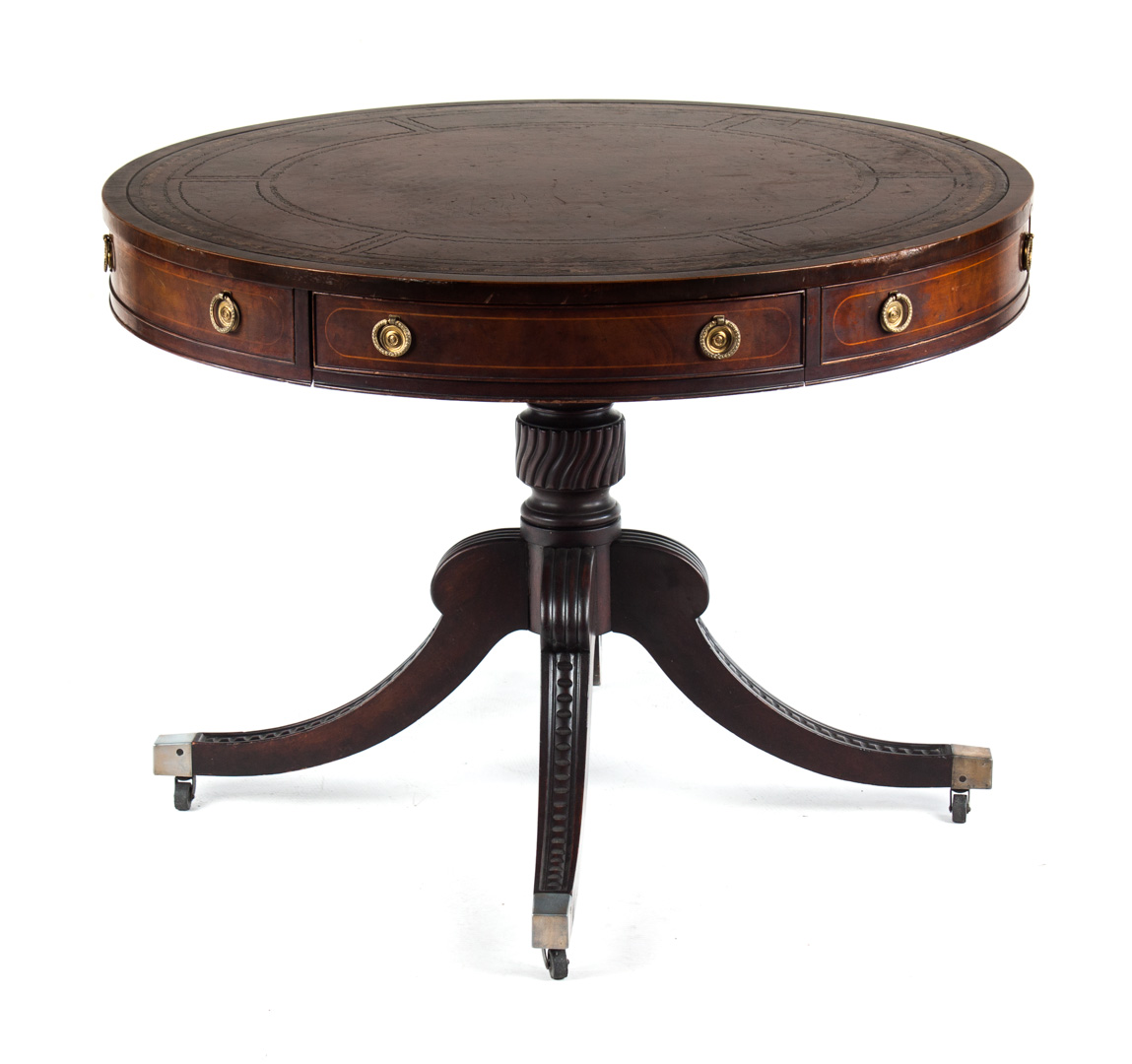 Appraisal: Baker mahogany leather top drum table in round gilt tooled