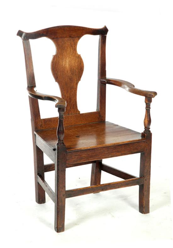 Appraisal: GEORGE III ARMCHAIR England th century oak Solid splat and