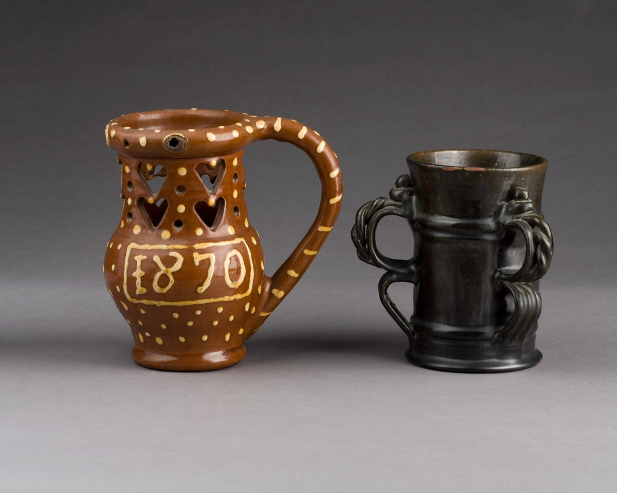 Appraisal: ENGLISH OR CONTINENTAL GLAZED REDWARE THREE-HANDLED TYG The turned mug