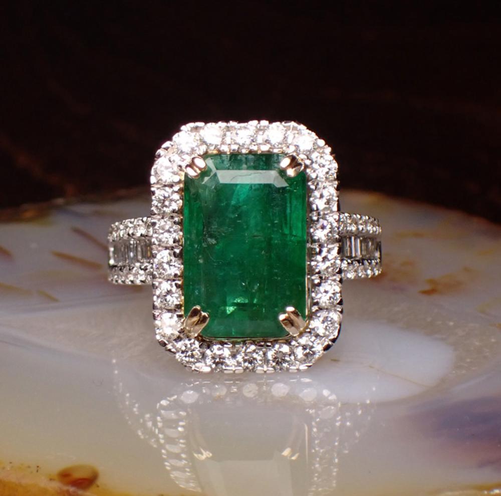 Appraisal: EMERALD DIAMOND AND FOURTEEN KARAT GOLD RING The k white