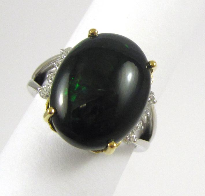 Appraisal: BLACK OPAL DIAMOND AND FOURTEEN KARAT GOLD RING The white