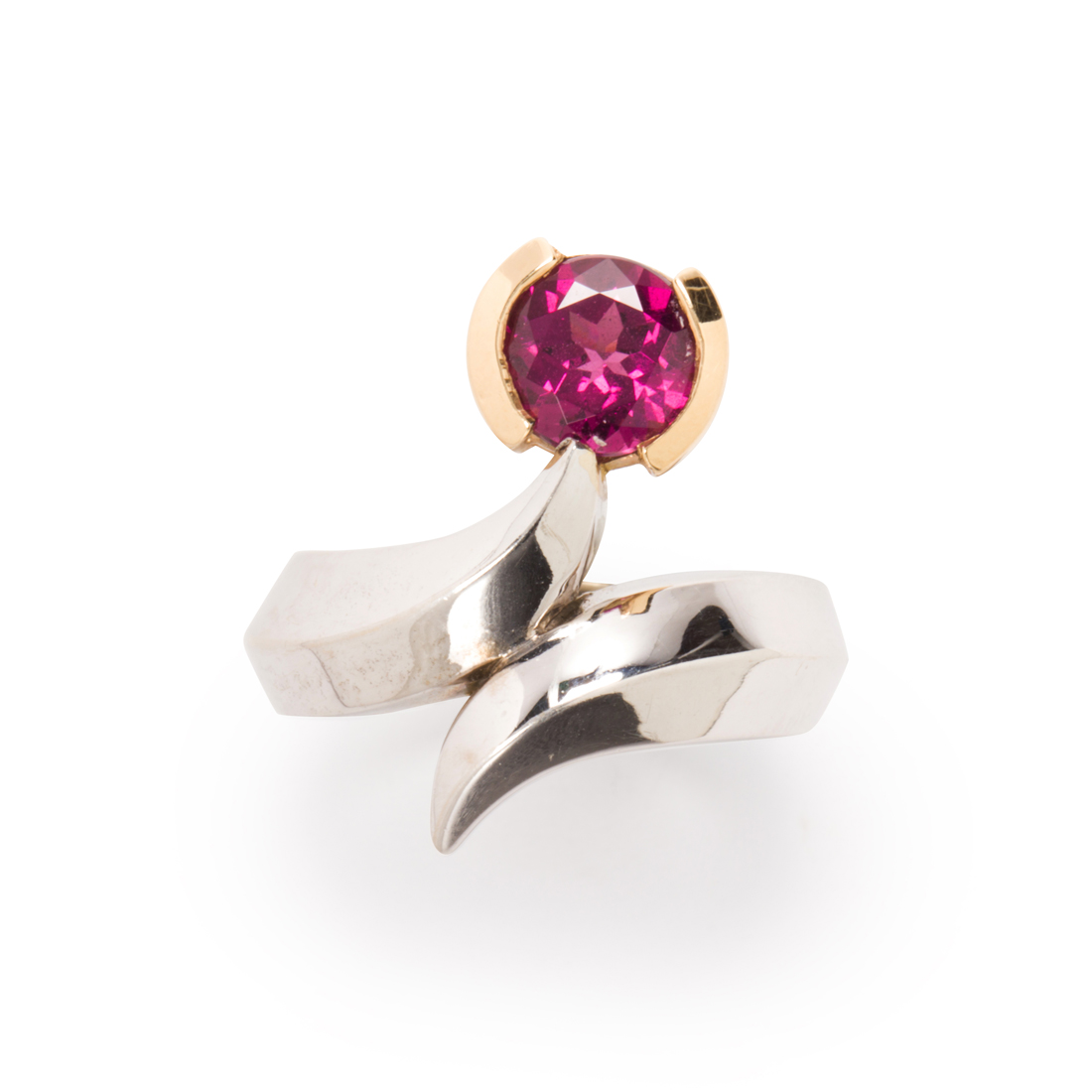 Appraisal: A RHODOLITE GARNET AND FOURTEEN KARAT BI-COLOR GOLD RING A