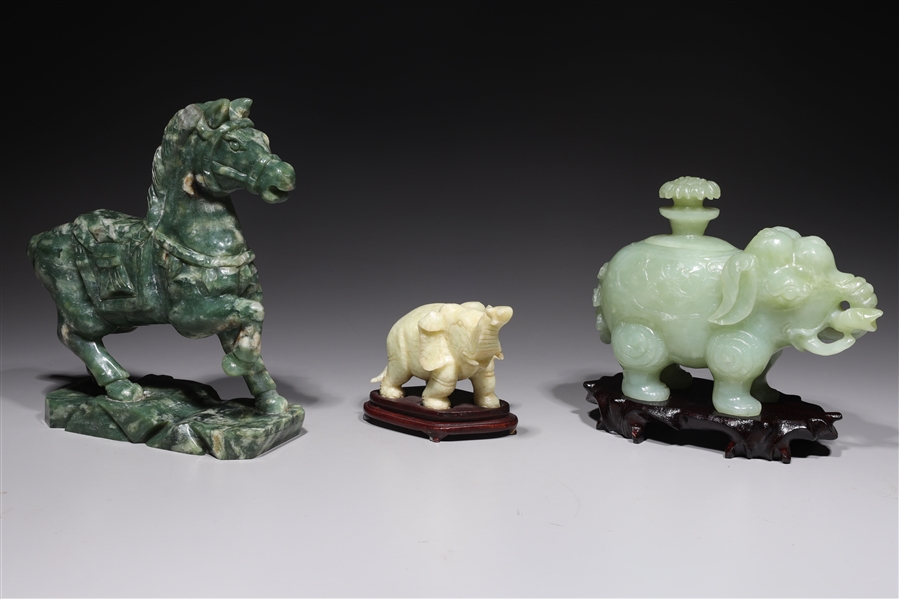 Appraisal: Group of three Chinese hardstone animal carvings including two elephants