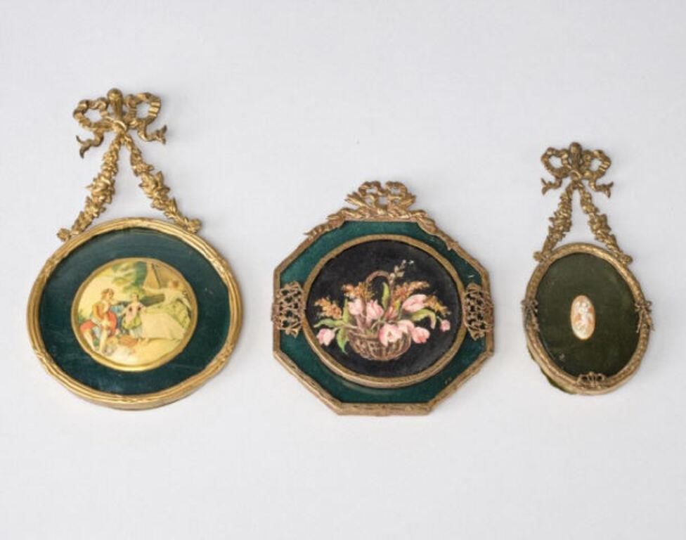 Appraisal: Three gilt metal framed miniature objects a carved shell cameo