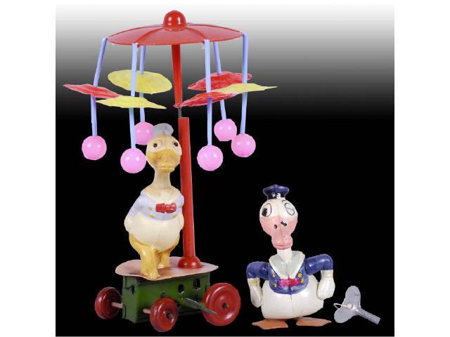 Appraisal: Lot of Walt Disney Celluloid Wind-Up Toys Description Carousel toy