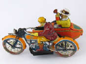 Appraisal: A tinplate wind up motor cycle sidecar combination