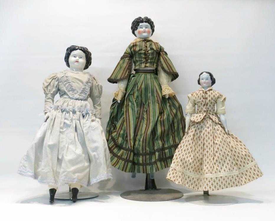 Appraisal: THREE AMERICAN CHINA HEAD DOLLS C Each with black molded