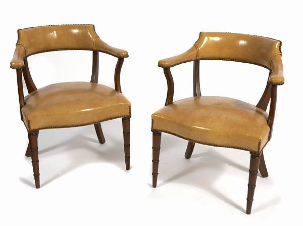 Appraisal: A pair of leather upholstered armchairs second half th century