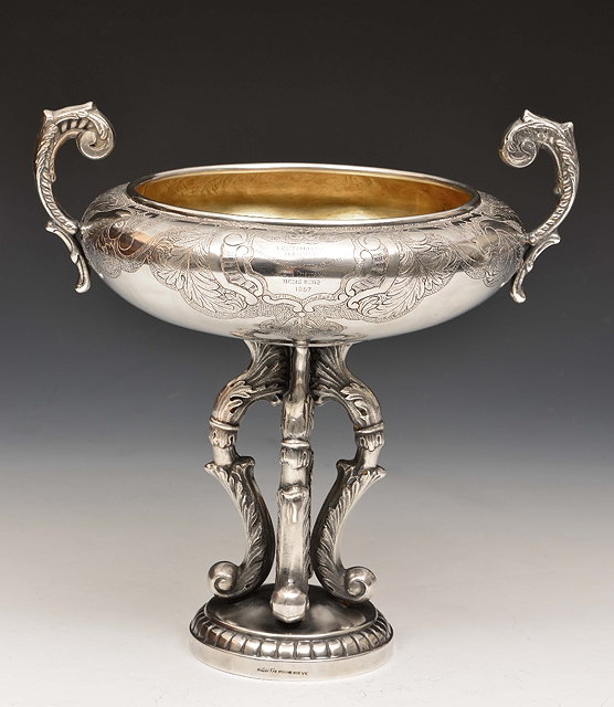 Appraisal: A CHINESE SILVER TROPHY of circular form with flying loop