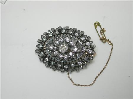 Appraisal: A Victorian diamond set brooch of shaped oval design with