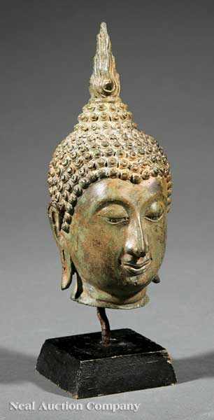 Appraisal: A Southeast Asian Bronze Head of Buddha modeled with a