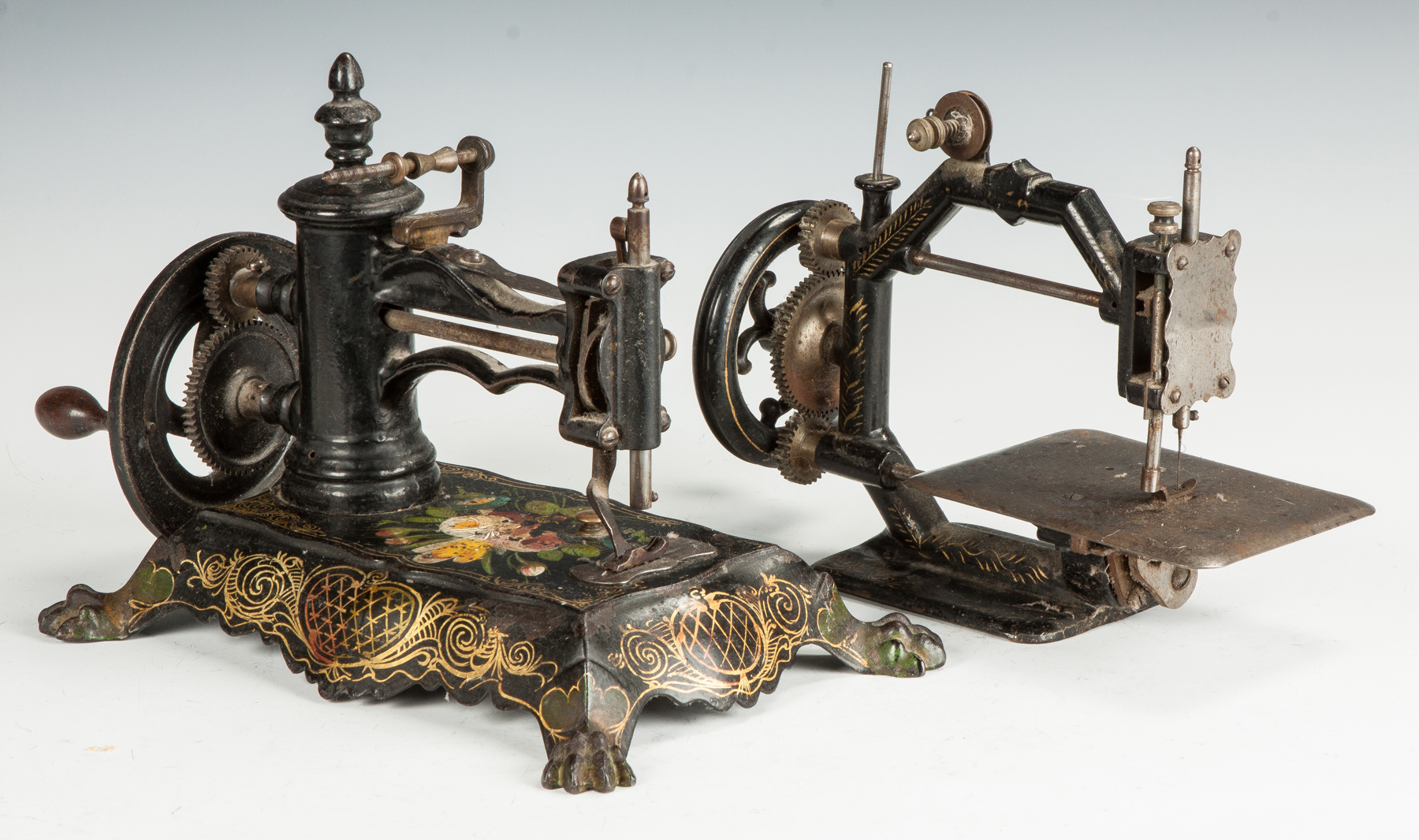 Appraisal: Two Hand Operated Cast Iron Sewing Machines L Wilson paw