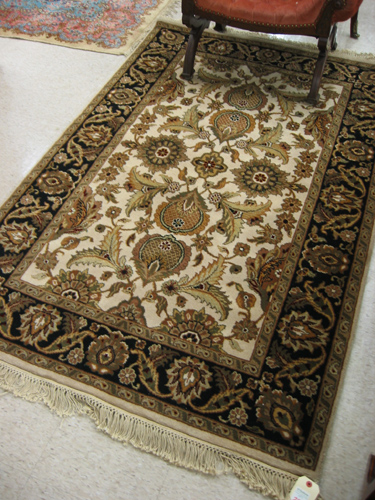 Appraisal: HAND KNOTTED ORIENTAL AREA RUG Indo-Persian overall floral design on