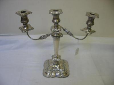 Appraisal: A CANDELABRUM comprising three waisted sconce on reeded scrolling branches