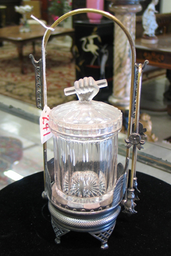 Appraisal: A SILVERPLATED PICKLE CASTOR having an arched handle supporting a