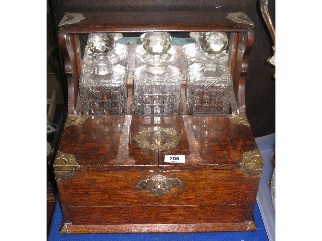 Appraisal: Oak and silver mounted three bottle tantalus humidor London