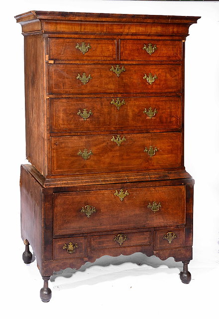 Appraisal: An th Century walnut chest on standtop section with two