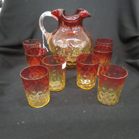 Appraisal: Amberina Art Glass Beverage Set thumbprint design pitcher and four