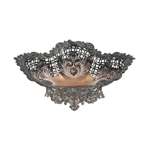 Appraisal: A Victorian silver sweetmeat dish stamped with leafy scrolls over