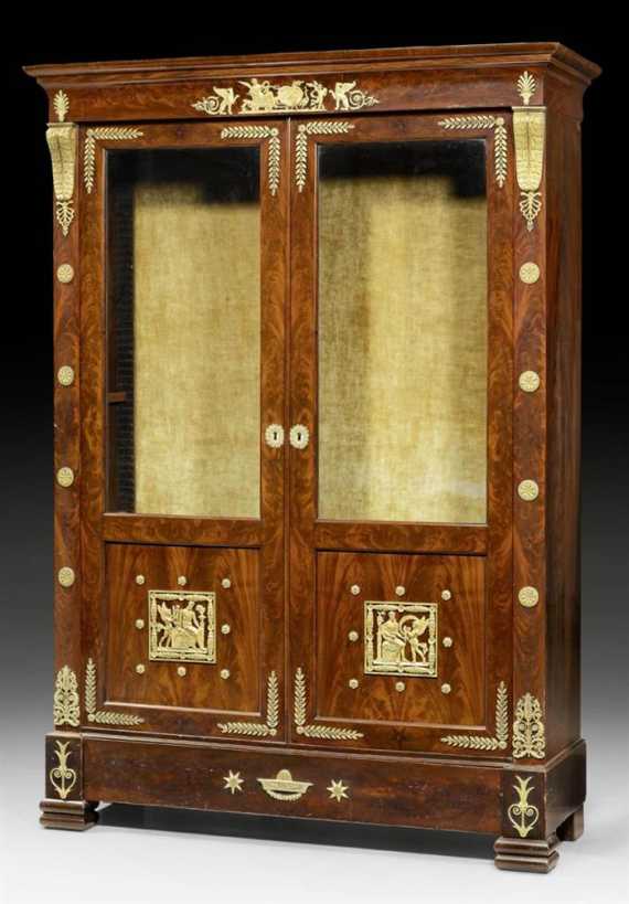 Appraisal: SMALL BOOKCASE AUX VOLUTES Empire Paris circa Shaped mahogany Fine