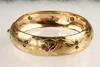 Appraisal: BRACELET - One K yellow gold hand engraved bangle bracelet