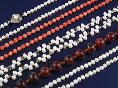 Appraisal: A freshwater cultured pearl and peridot bead necklace Two freshwater