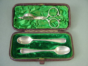 Appraisal: A cased pair of silver miniature rat tail serving spoons